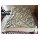 Vintage hand made florette quilt