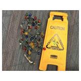 Caution floor sign, and Christmas Lights