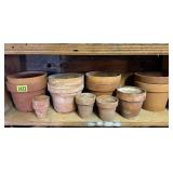 Shelf of clay flower pots