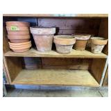 Shelf of clay flower pots