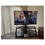 Sharp 60' television, media stand, antenna, remote