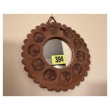 Pressed clay wall mirror