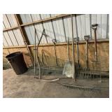 Trash can, primitive yard tools, rake, scythe,