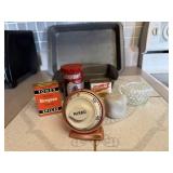 Cake pan, copper kitchen timer, spice tins,