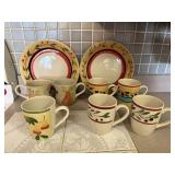 Mixed lot of stoneware dishes, plates, bowls, cups