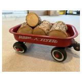 Toy Radio Flyer wagon, logs included