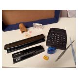 Office supplies, paper punch, staper, calculator,