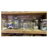 Shelf of jars with contents, miniatures, thread