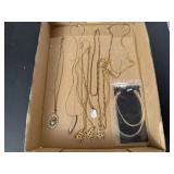 Assorted costume jewelry, gold chains, extensions