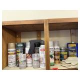 Shelf of consumables, spray paint, chore gloves,