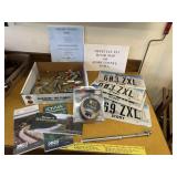Automotive lot, license plates, maps, tools