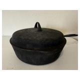 Deep covered cast iron skillet