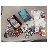 Decks of playing cards, score cards, strategy