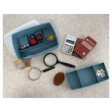 Tupperware container, magnifying glasses,