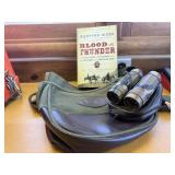 Satchel, binoculars, book