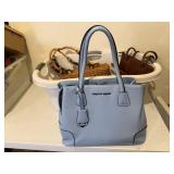 Laundry basket of purses