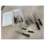 Storage tote of cutlery, steak knives, paring