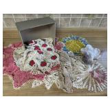 Assorted doilies, table runner