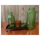 Green glassware, bottles, amber votive holder