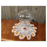 Glass pedestal covered dish, doilie
