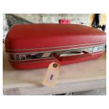 Red Samsonite suitcase