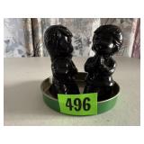 Praying girl, boy statues