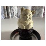 Nesting kitten cologne bottle