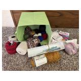 Storage tote, yard, spools of thread, knitting