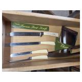 Vintage stainless cutlery, advertising knives