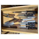 Contents of cutlery drawer, steak knives