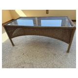 Glass top wicker coffee table