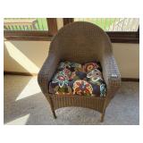 Wicker arm chair with cushion