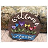 Welcome 'Love Grows Here' sign