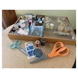 Box of sewing notions, scissors, spools of
