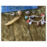 Stone charm bracelet, costume rings, hair clip