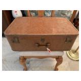 Suitcase, crochet tablecloths, doilies, magazine