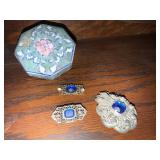 Porcelain trinket box, antique brooches