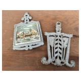 Currier & Ives, cast iron trivets (2)