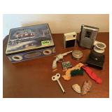 Toy gun, lighter, cup, arrowhead, radio, recorder