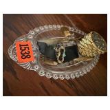 Dish, antique brooch, votive holder, spoon, knife