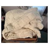 Box of beige afghans
