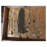 Nautical tin of necklaces, pendants