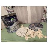 Tin of crocheted, handiwork