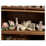 Shelf of shabby chic decor, vases, music boxes
