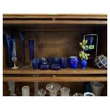 Shelf of cobalt glassware