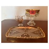Thumbprint compote, gold rimmed plate, toothpick