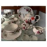 Plain pink rose china teapot, dishes