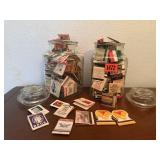 Glass canisters of matchbooks (2)