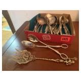 Box of silver serving utensils, tongs