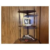 Small corner tiered shelf, trinkets, Holy Bible